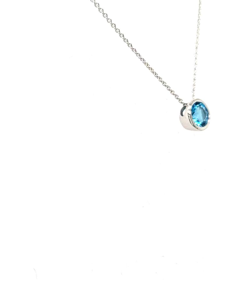 anhaenger-blauer-mIttelstein-edeltopas-gelbgold-juwelier-risch