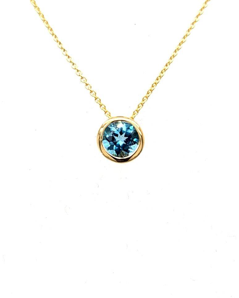 anhaenger-blauer-mIttelstein-edeltopas-gelbgold-juwelier-risch